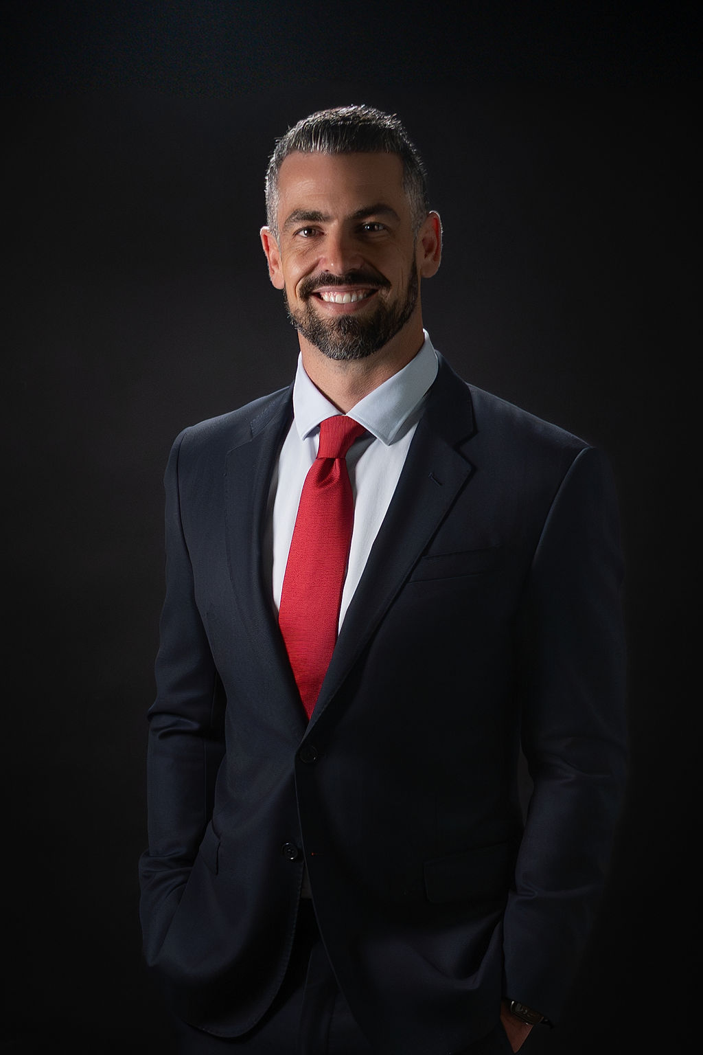 Daniel Freeman smiling in a dark suit